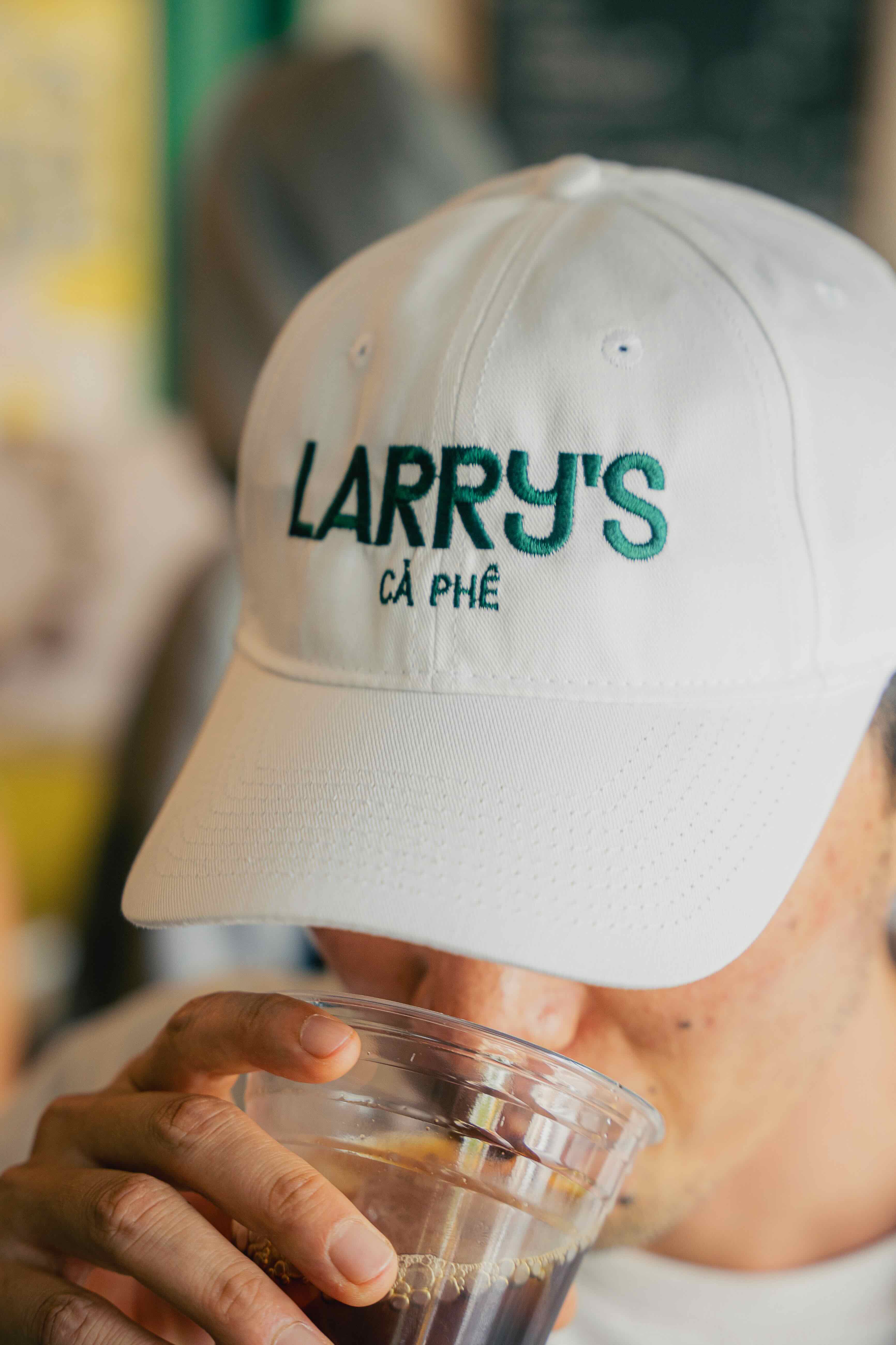 Larrys merch white and yellow hat alternate photo